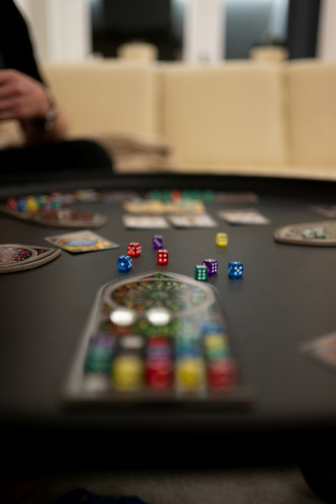 featured-images-04 a-black-table-topped-with-lots-of-dice-3bdzm8liszm